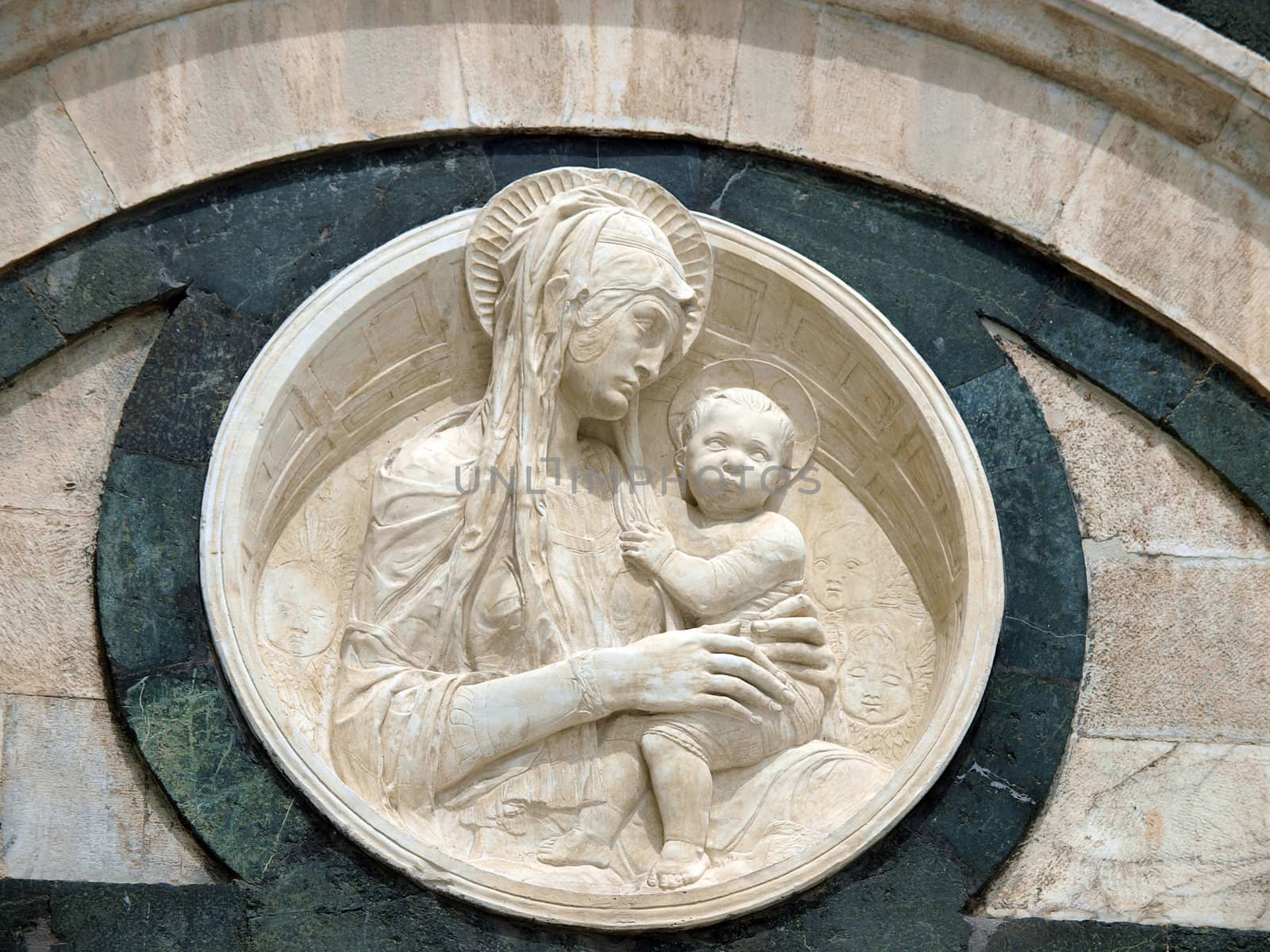 Architectural details of Duomo facade - Siena,Tuscany,Italy. The Duomo of Siena, which was built in the 12th and 13th centuries, is one of the prettiest churches in Gothic style in Italy