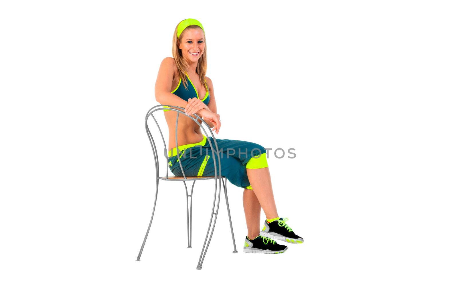 Young fitness instructor sitting on chair