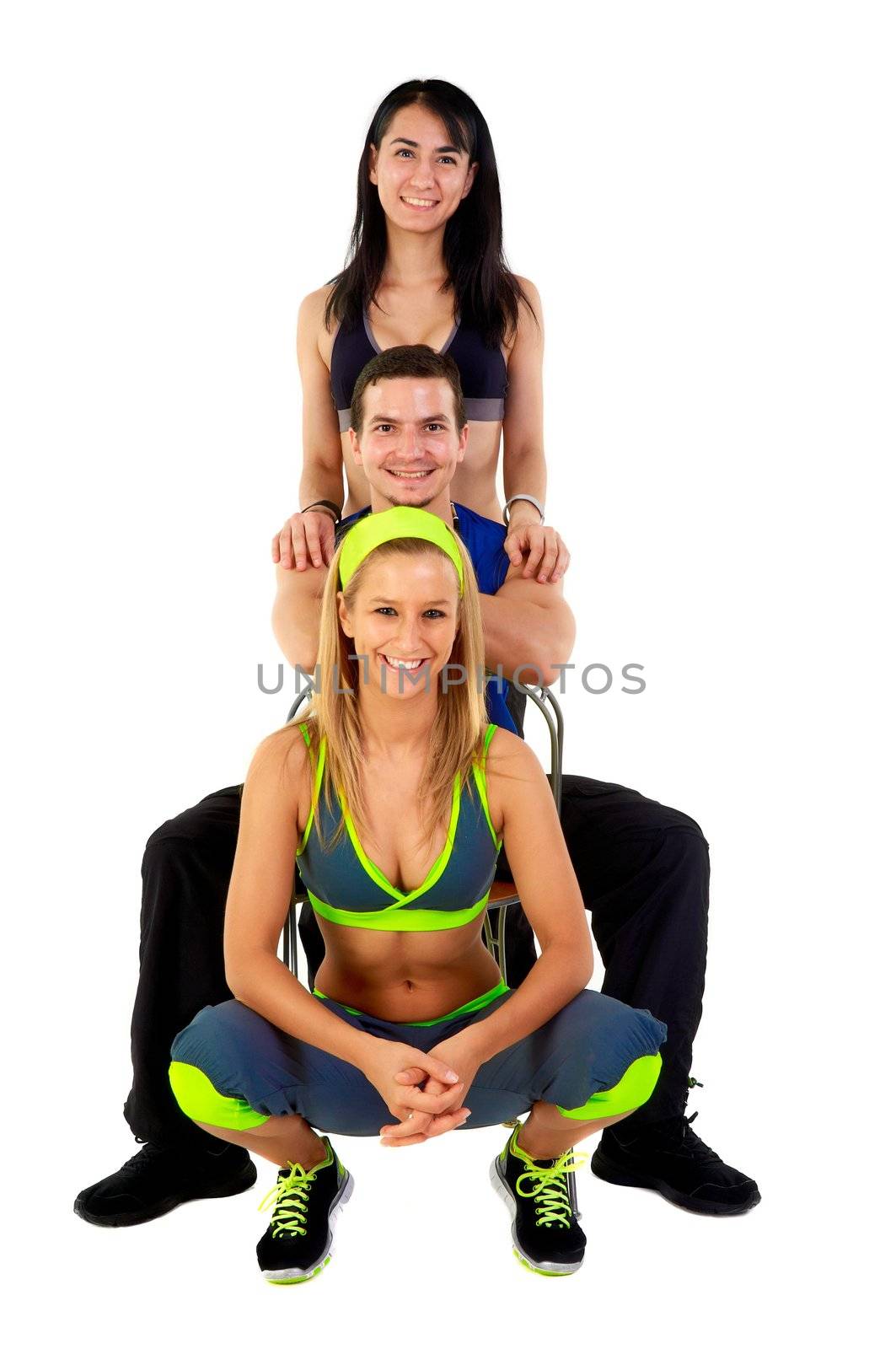 Young fitness instructors against white background