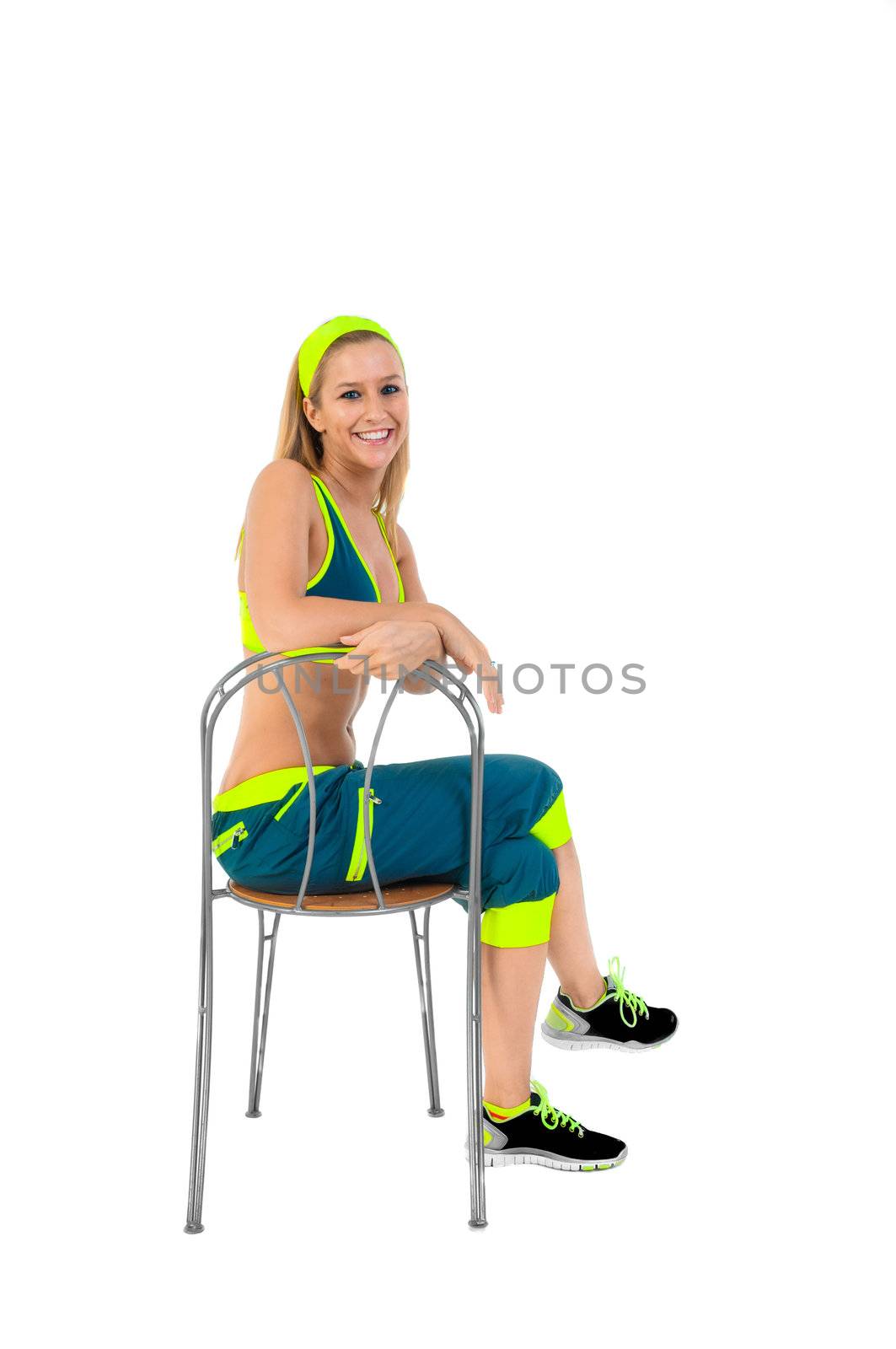 Young fitness instructor sitting on chair