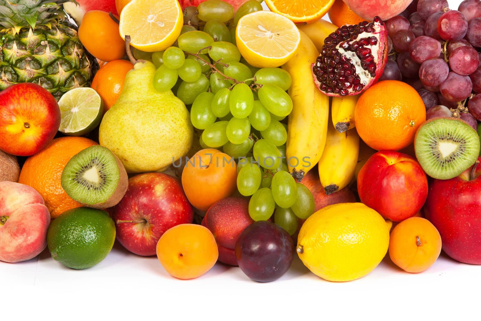 Huge group of fresh fruits isolated on a white background. Shot in a studio