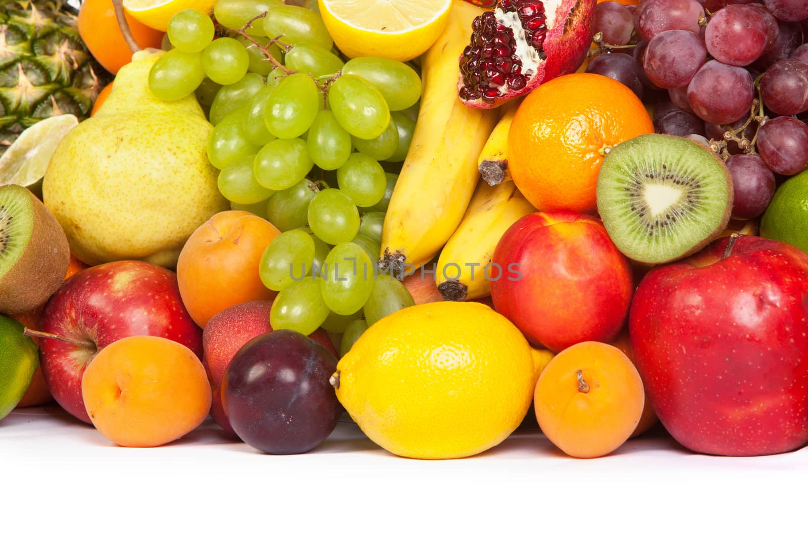 Huge group of fresh fruits isolated on a white background. Shot in a studio