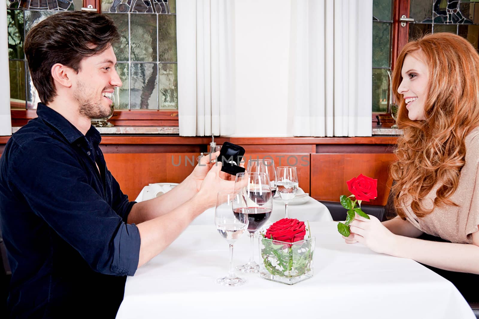 happy couple in restaurant romantic date love dinner valentines day wedding