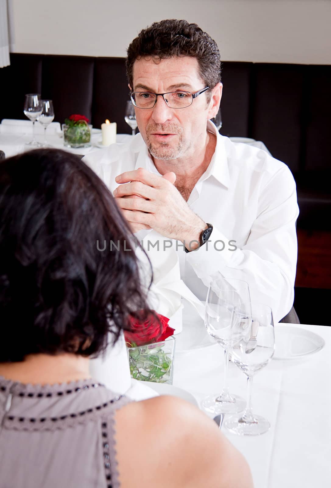 happy smiling couple in restaurant celebrate toast champagne dinner