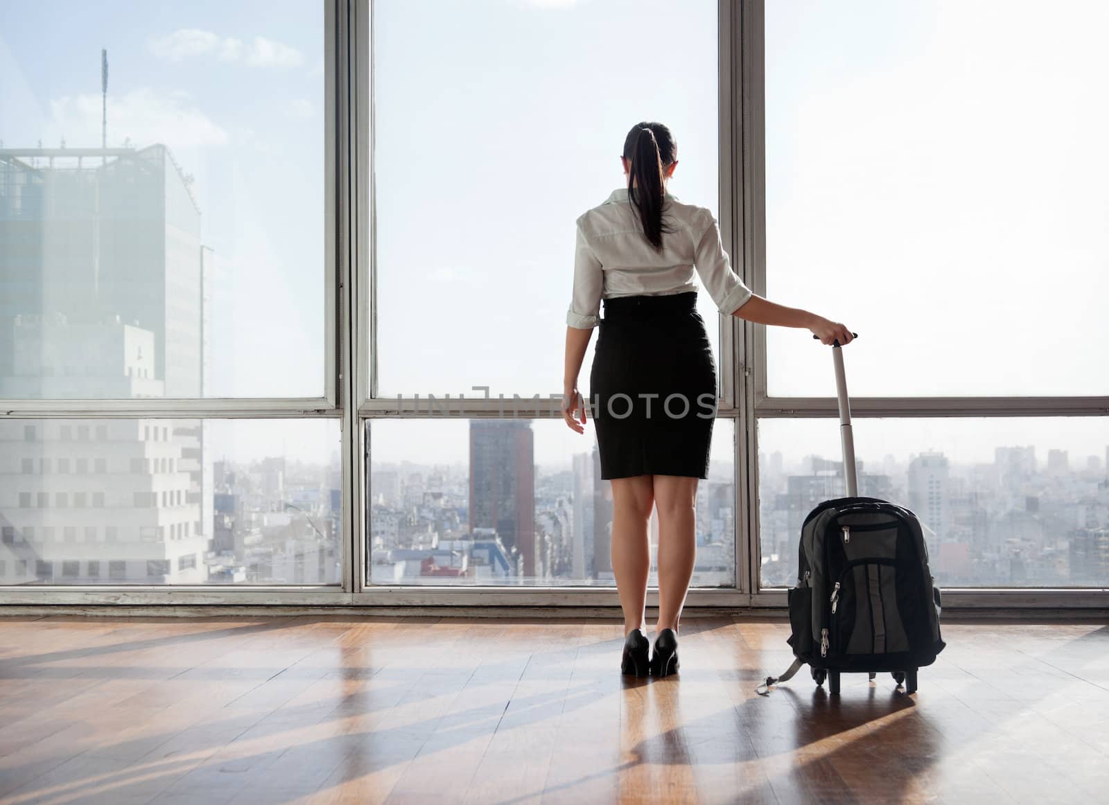 Businesswoman With Luggage Trolley by leaf