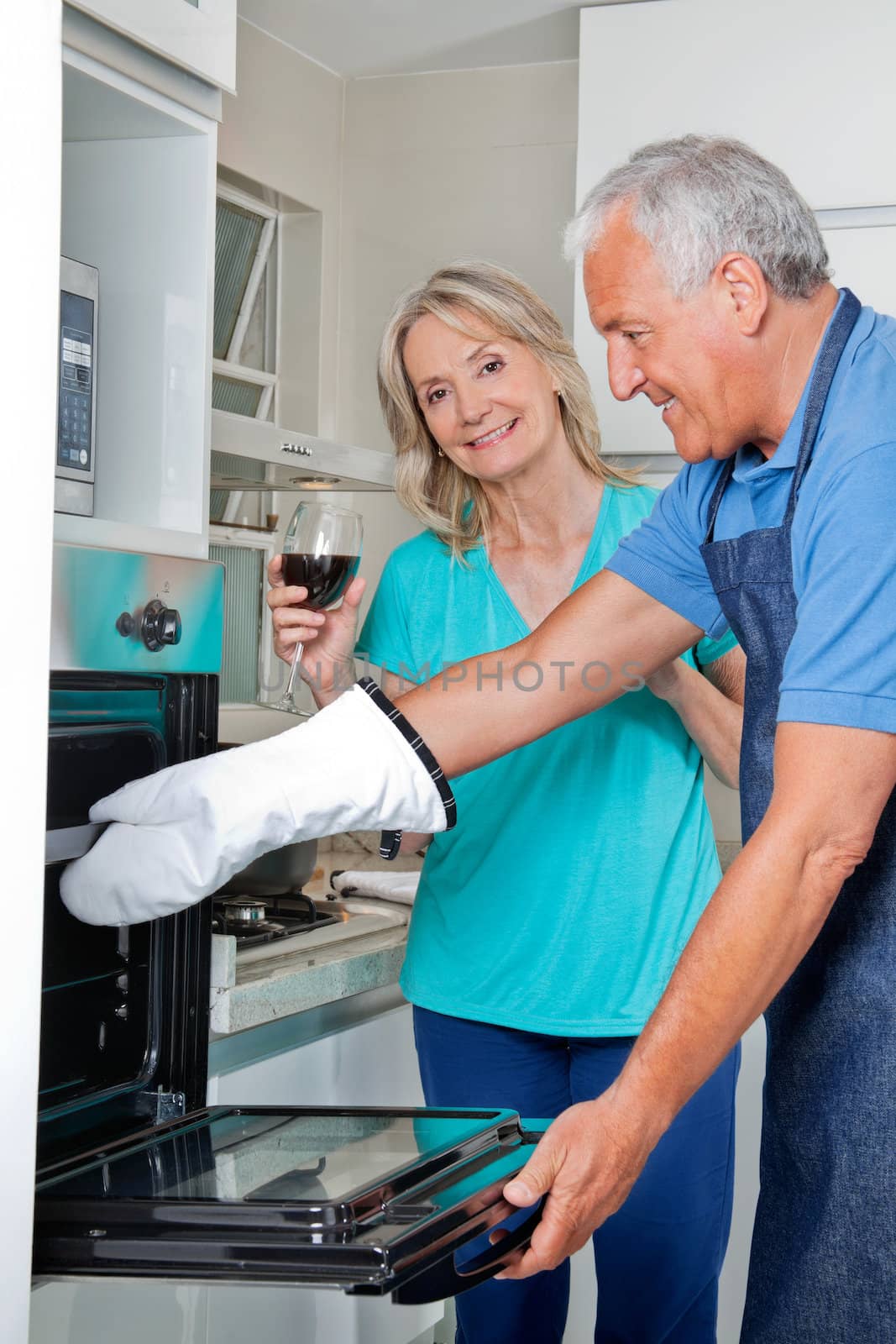 Man Baking Food in Oven by leaf