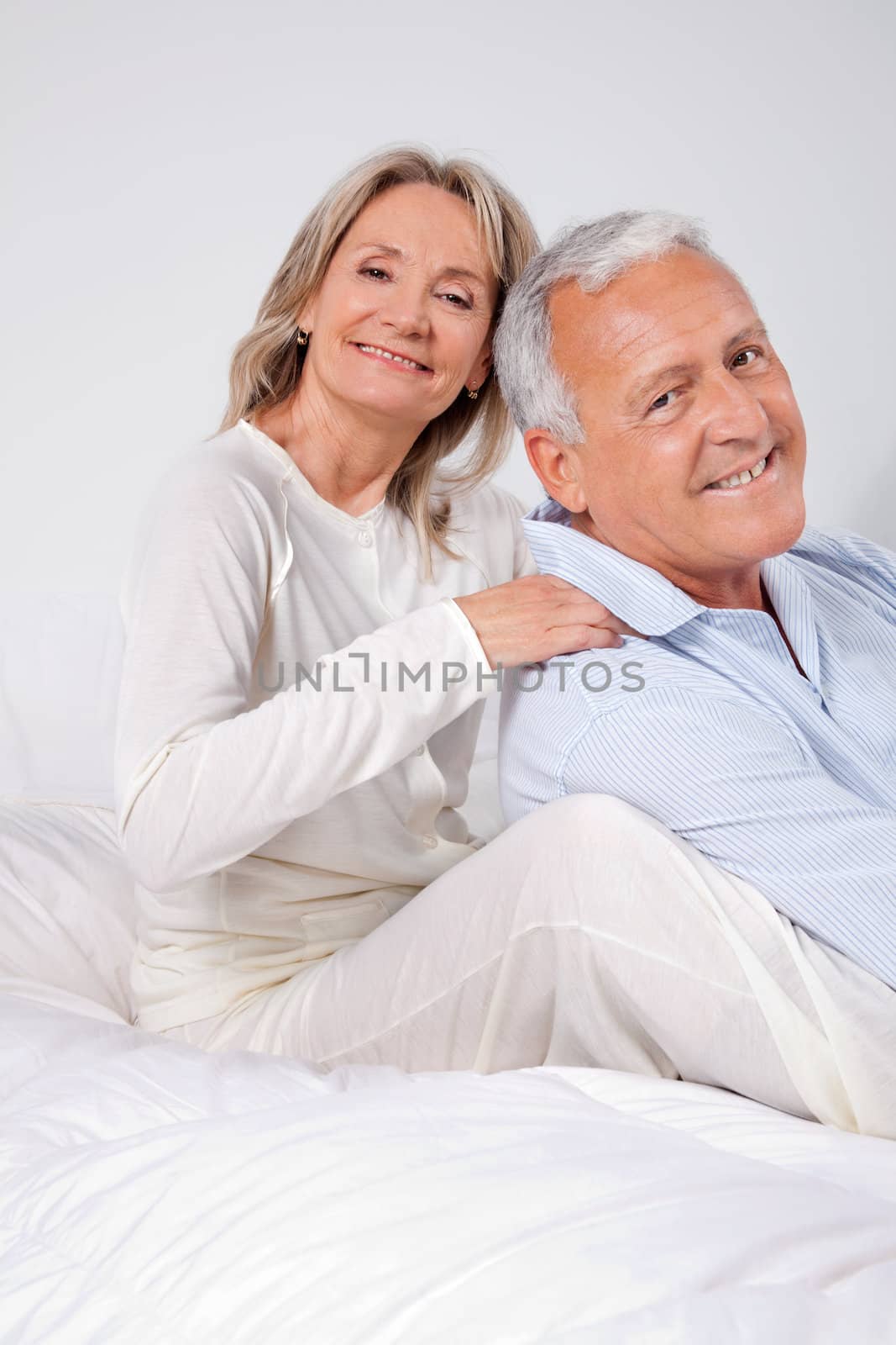 Couple Sitting Together by leaf