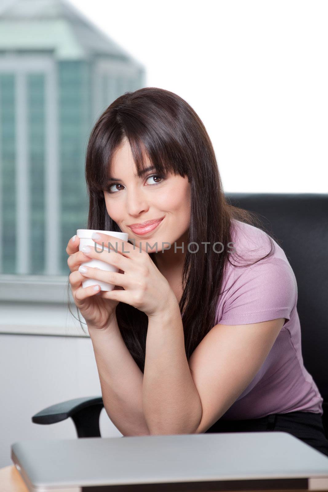 Portrait of a business woman holding coffee cup and dreaming