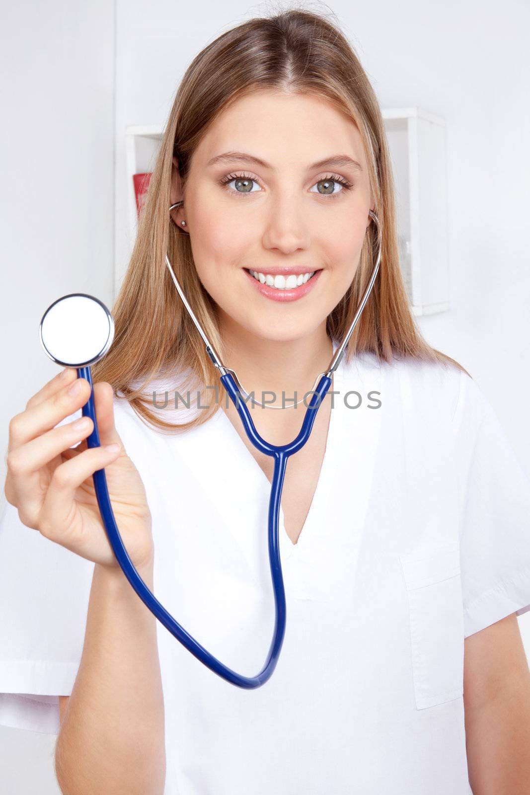 Female doctor with a stethoscope listening.