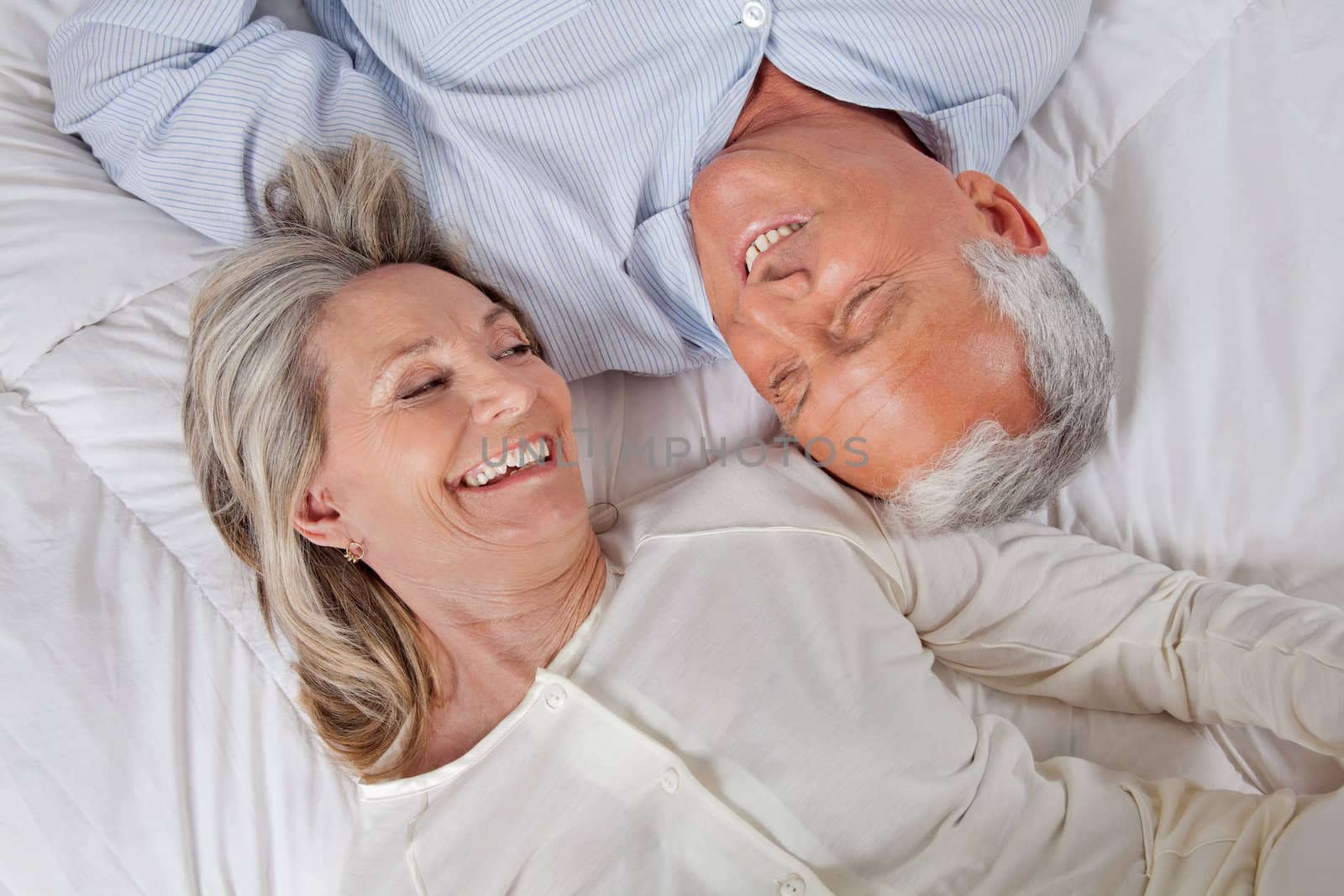Couple Lying in Bed by leaf