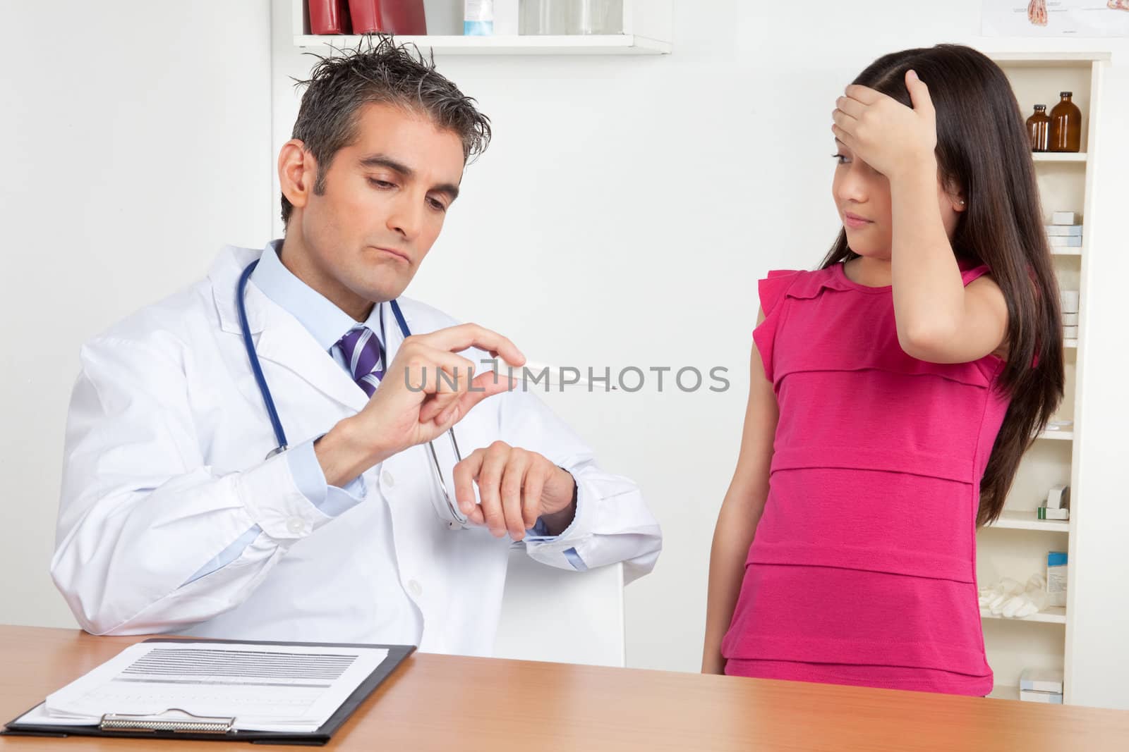 Doctor Measuring Temperature of Girl by leaf
