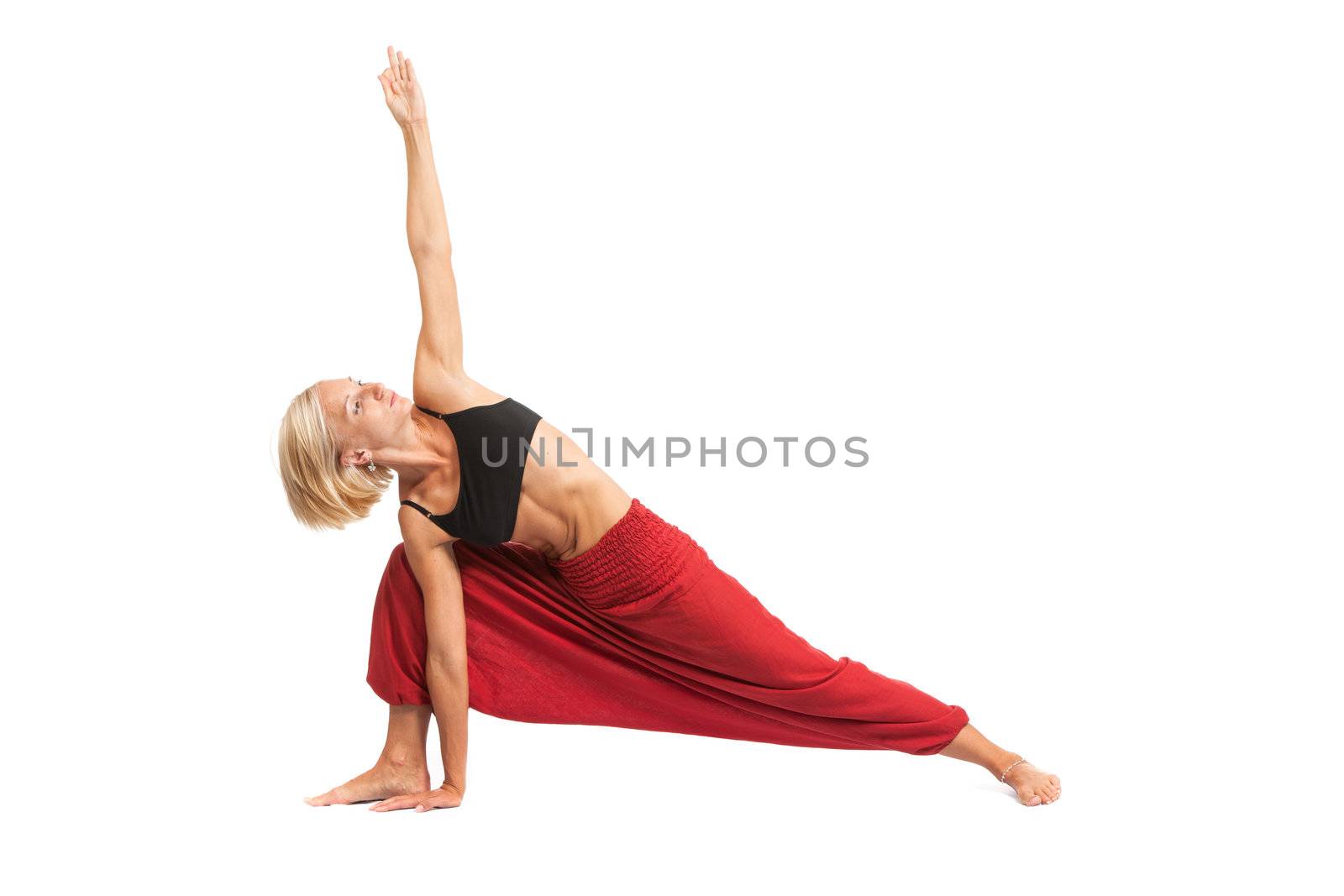 Practicing Yoga. Young woman isolated on white background by bloodua