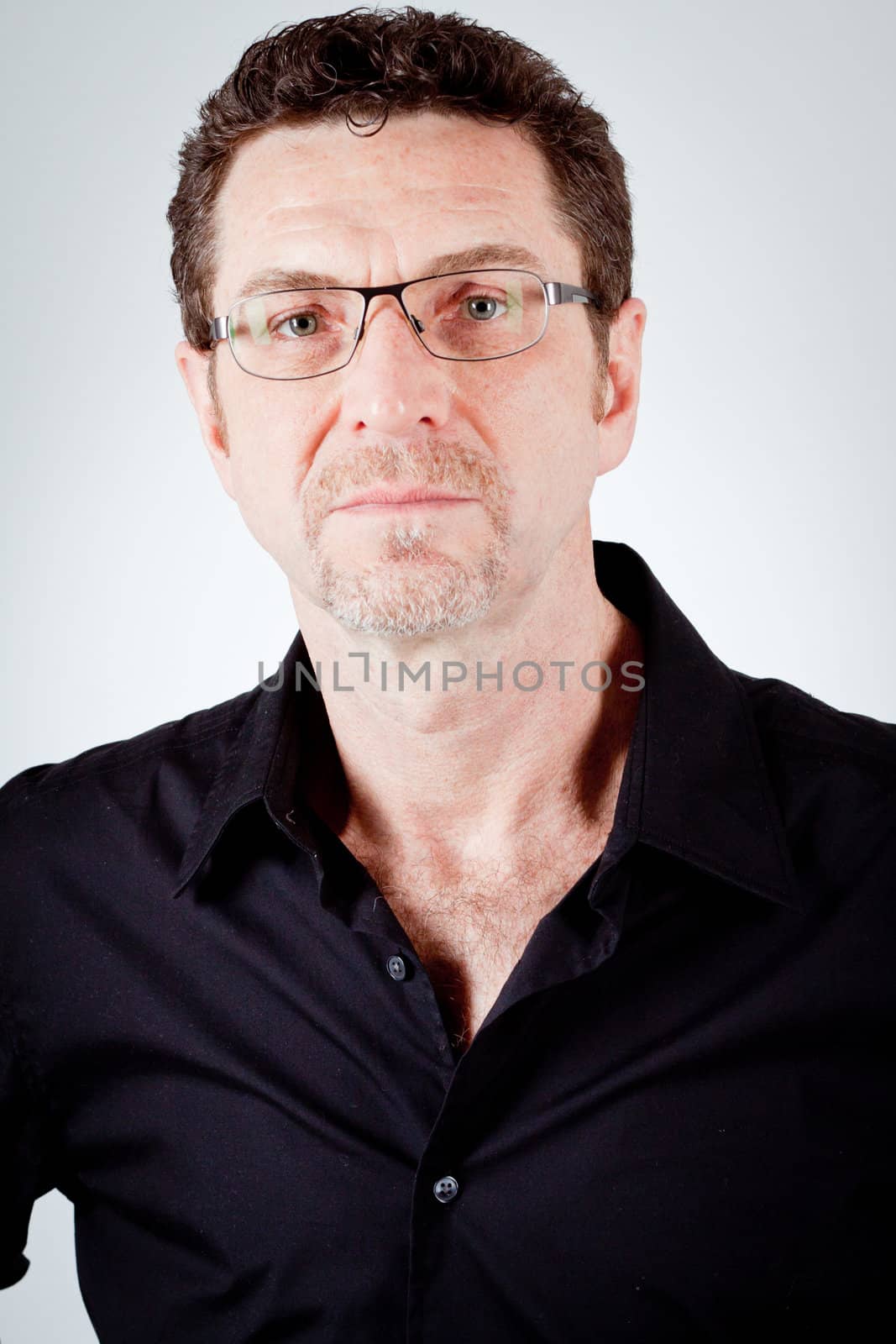 attractive adult man with glasses and black shirt portrait 