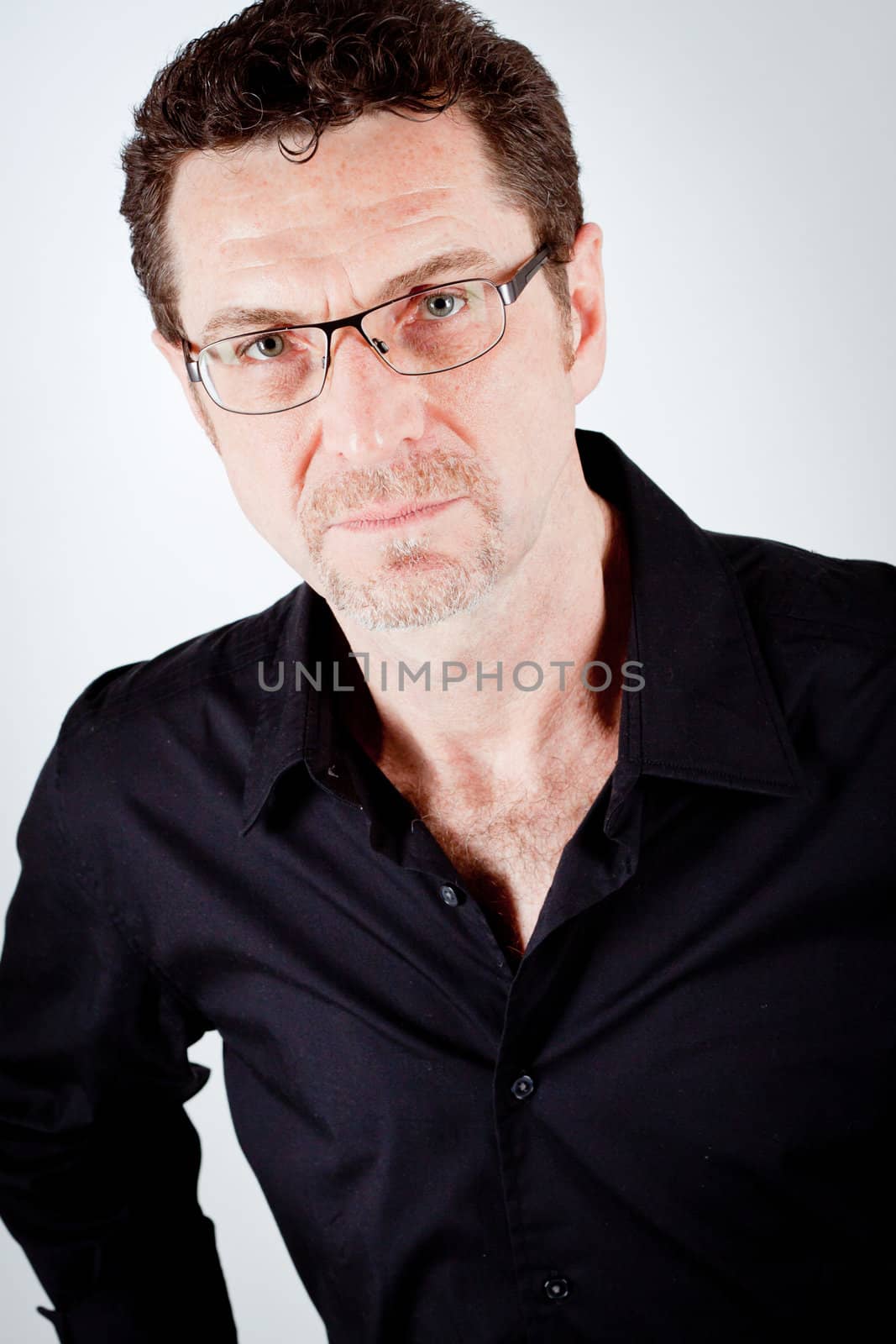 attractive adult man with glasses and black shirt portrait 