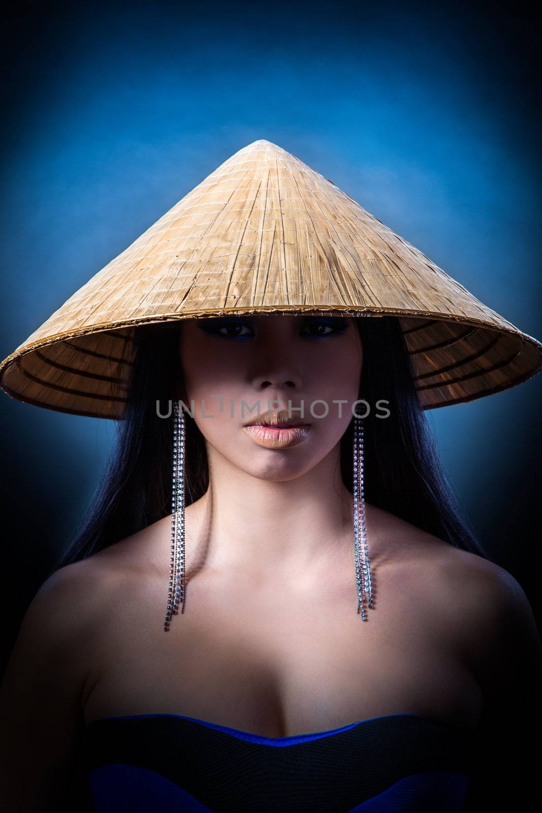 Beautiful brunette Asian woman with long black hair wears vietna by bloodua