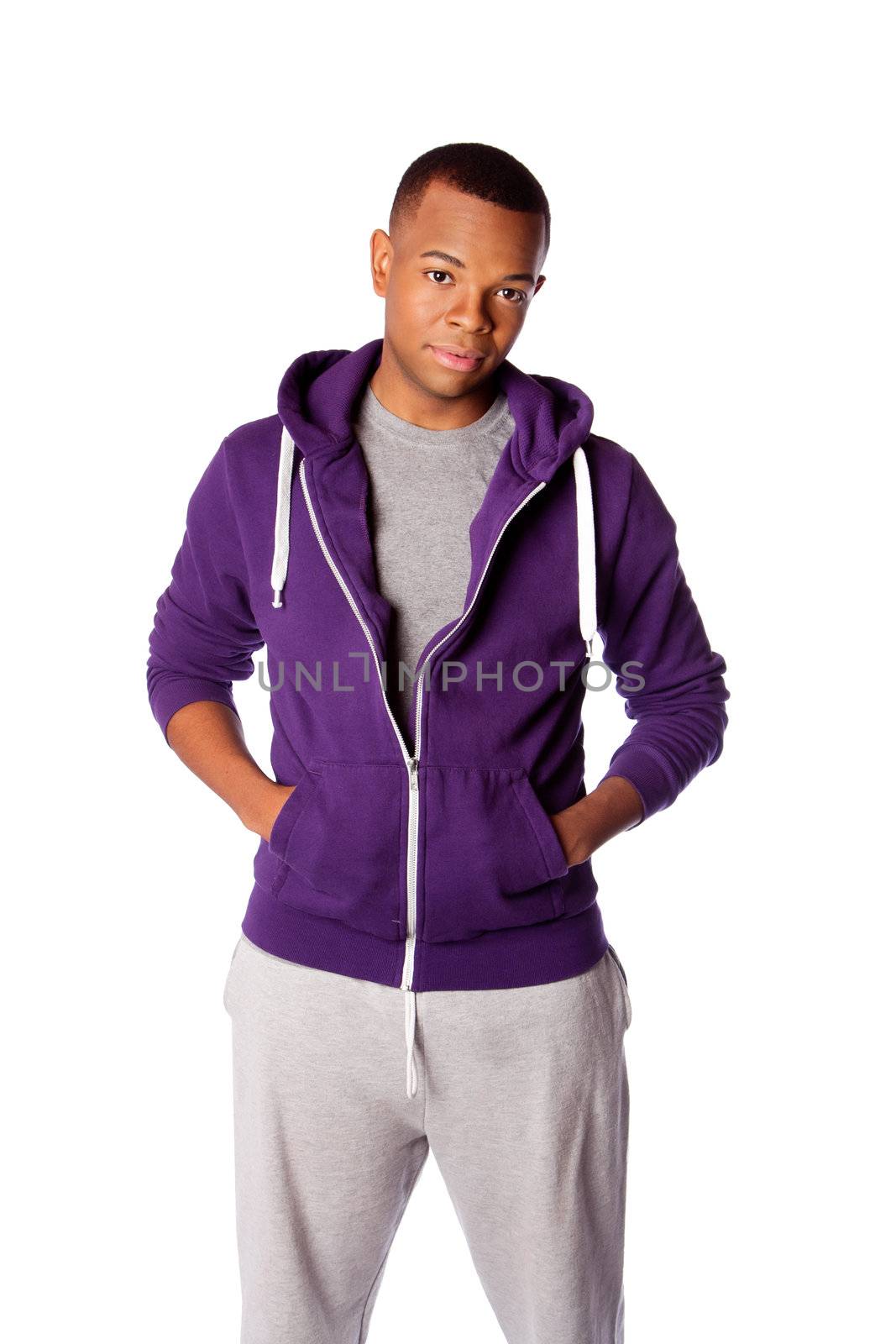 Young handsome man ready for sports wearing purple hooded sweatshirt and gray training pants, isolated.