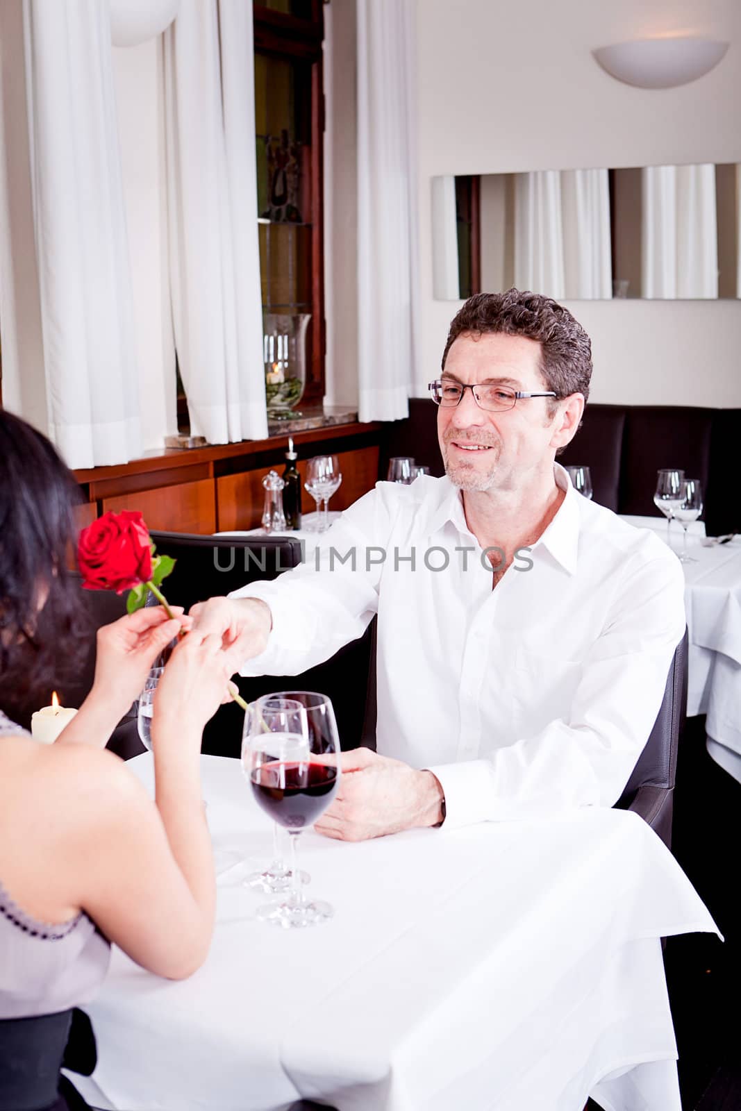 happy couple in restaurant romantic date love dinner valentines day wedding