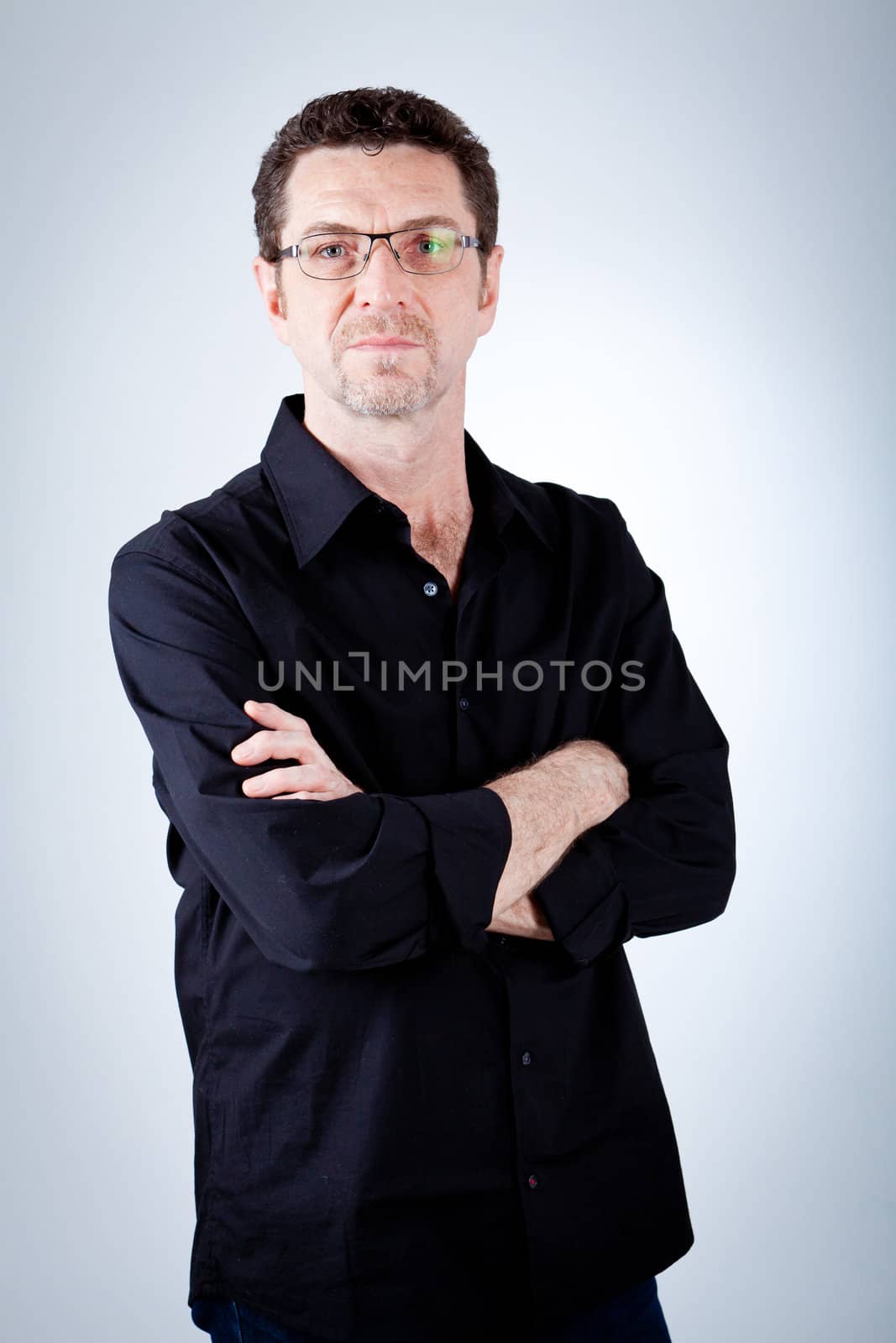 attractive adult man with glasses and black shirt portrait 