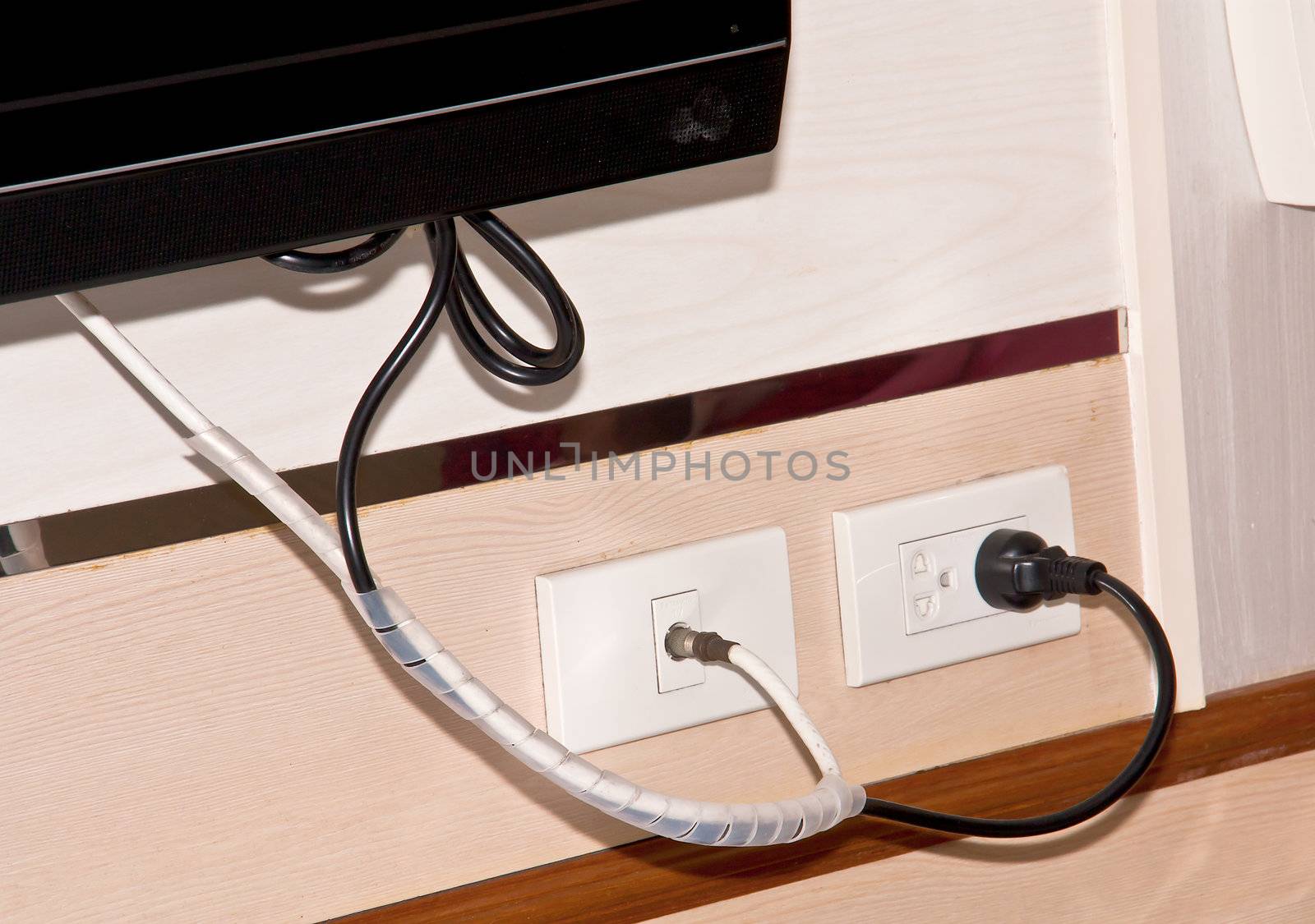 Electrical outlet and TV. by Theeraphon