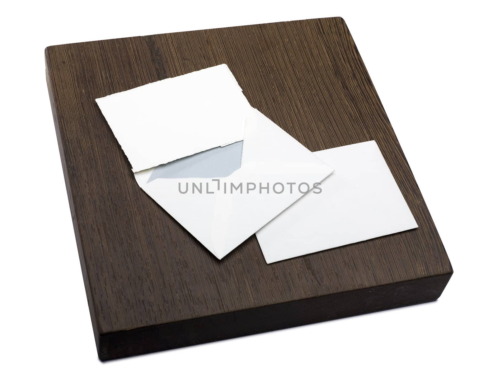 wooden block with a letter and an envelope by pbombaert