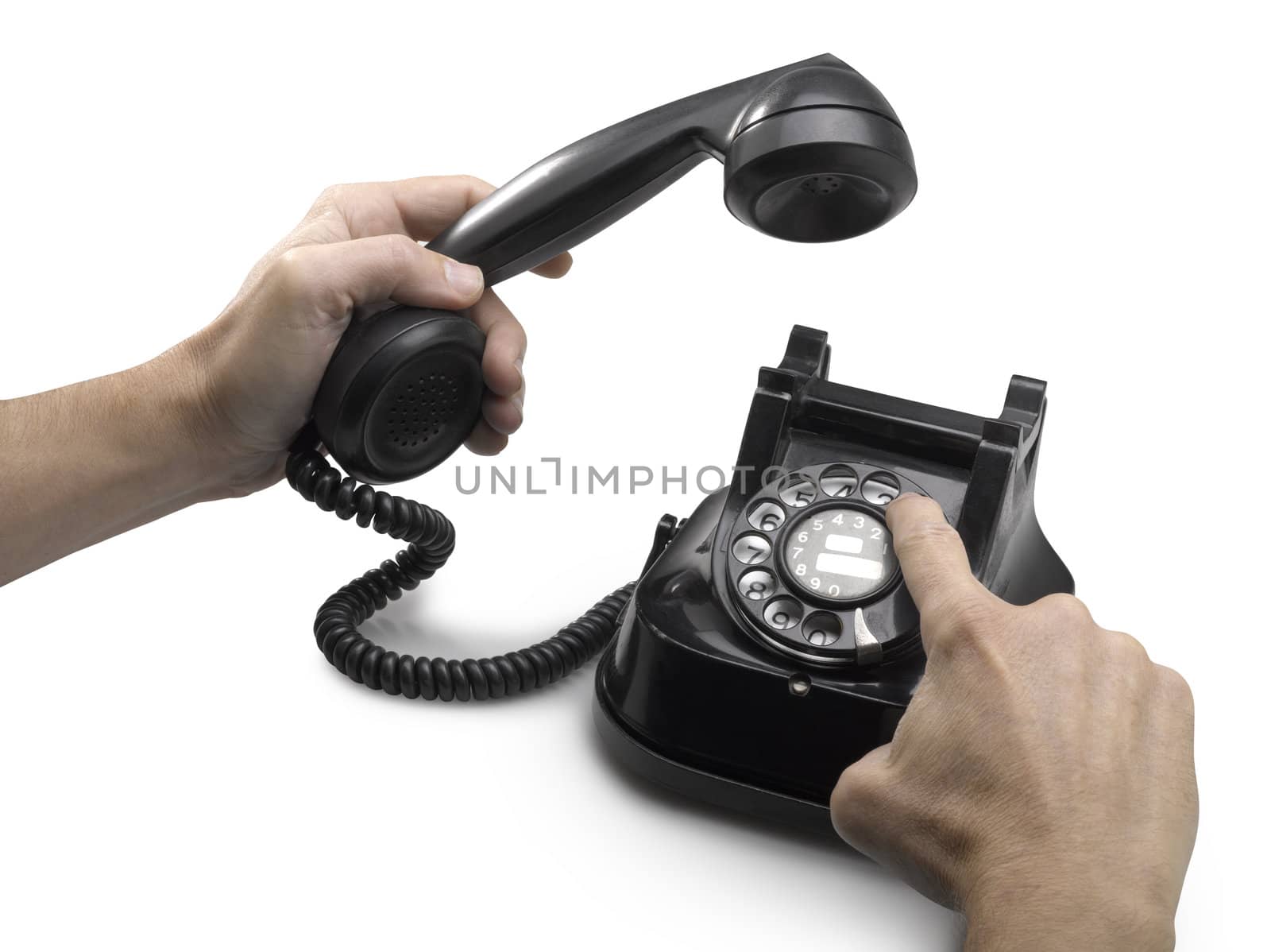 old telephone dial with hands.(clipping path)