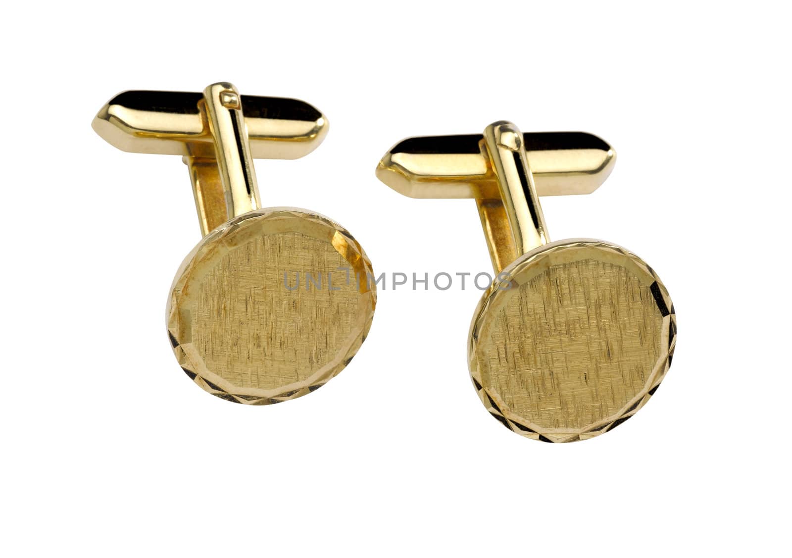 Gold cuff link isolated on white background