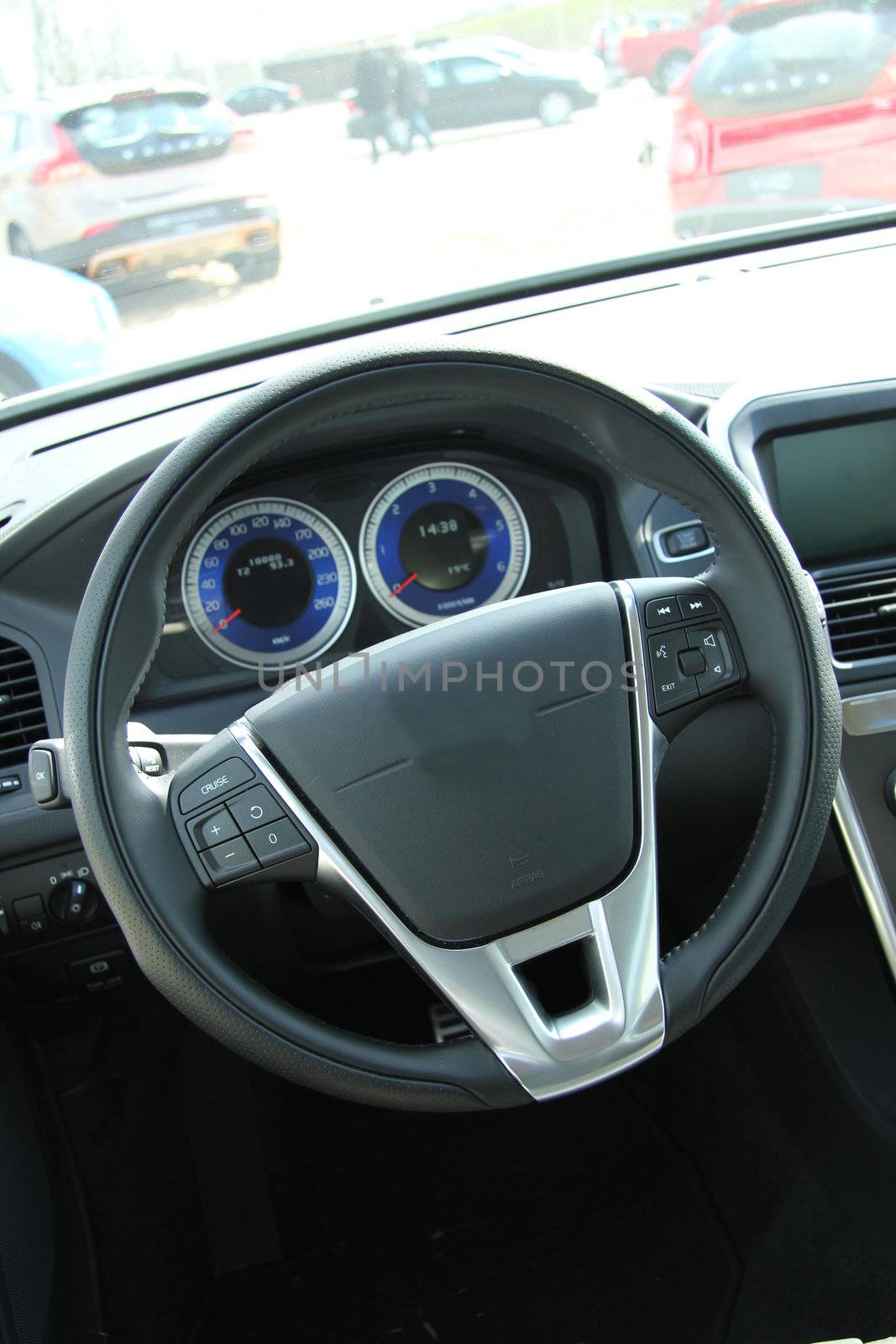 Dashboard and interior of a brand new car, leather and stainless steel