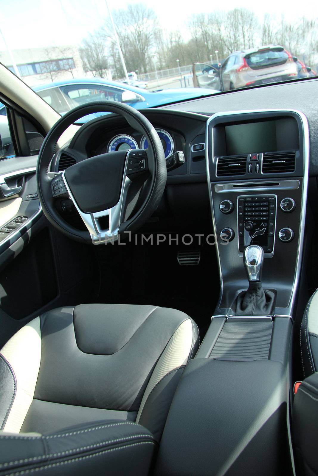 Dashboard and interior of a brand new car, leather and stainless steel