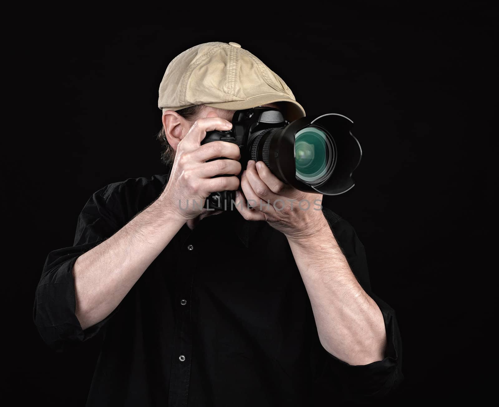 A photographer with a nice camera on black background