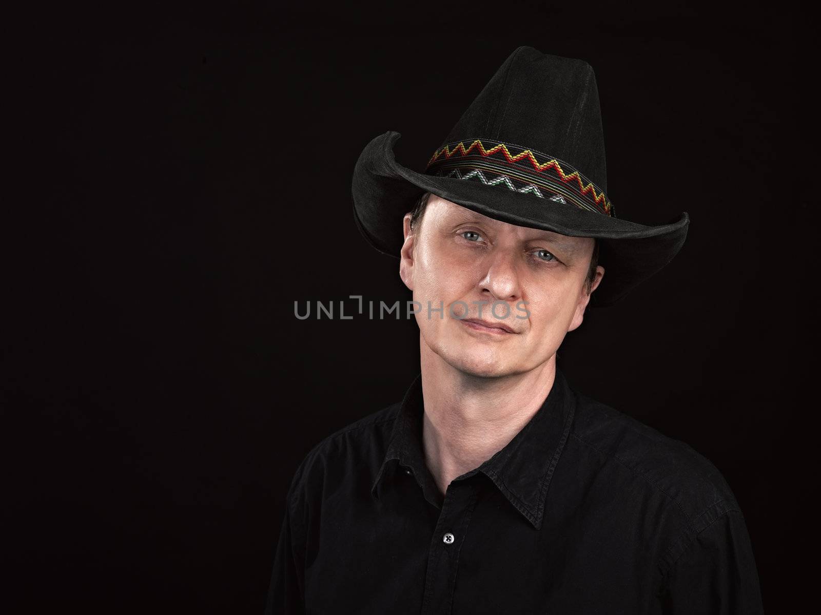 Portrait of a man with cowboy's hat 