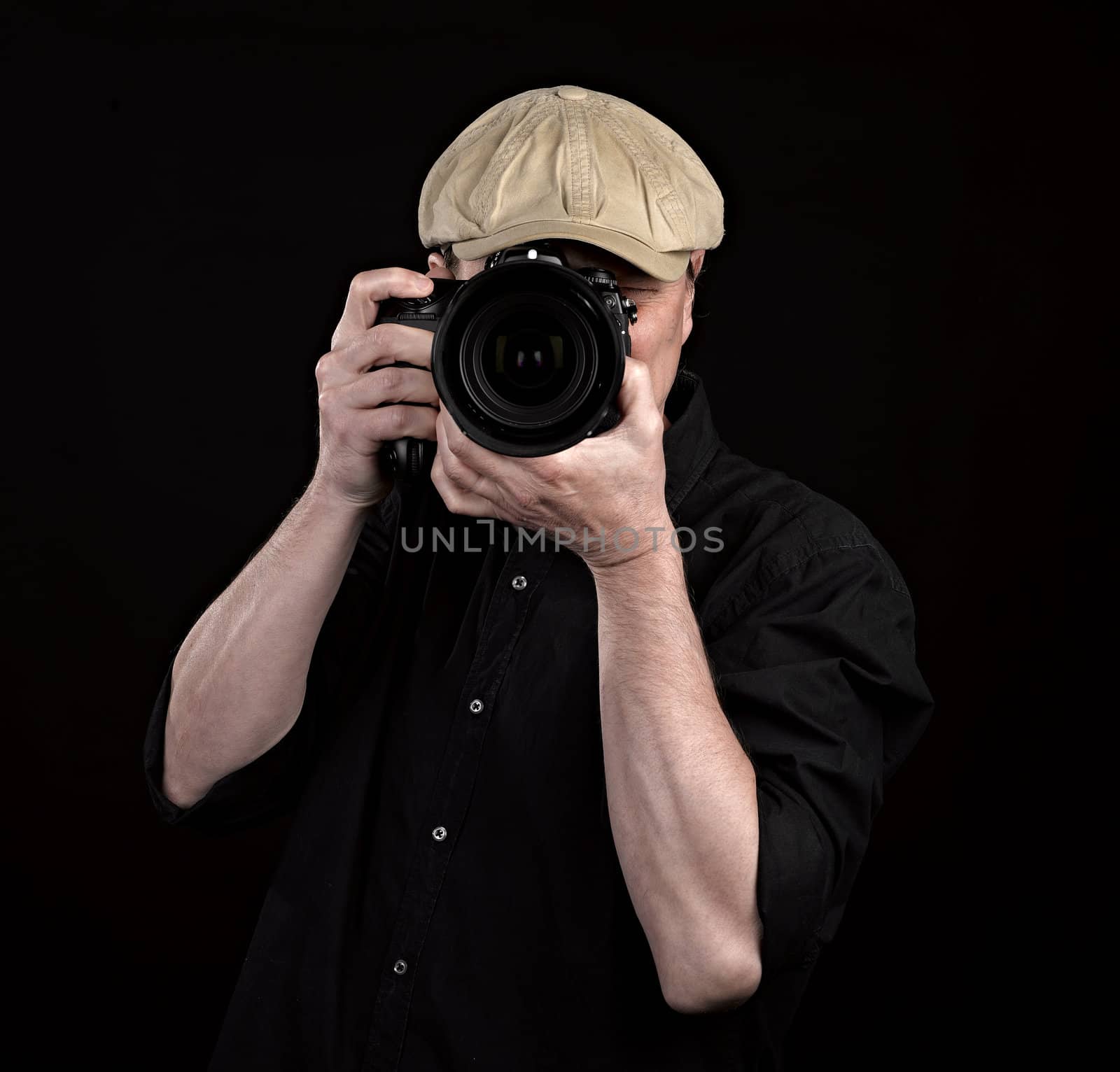 A photographer with a nice camera on black background