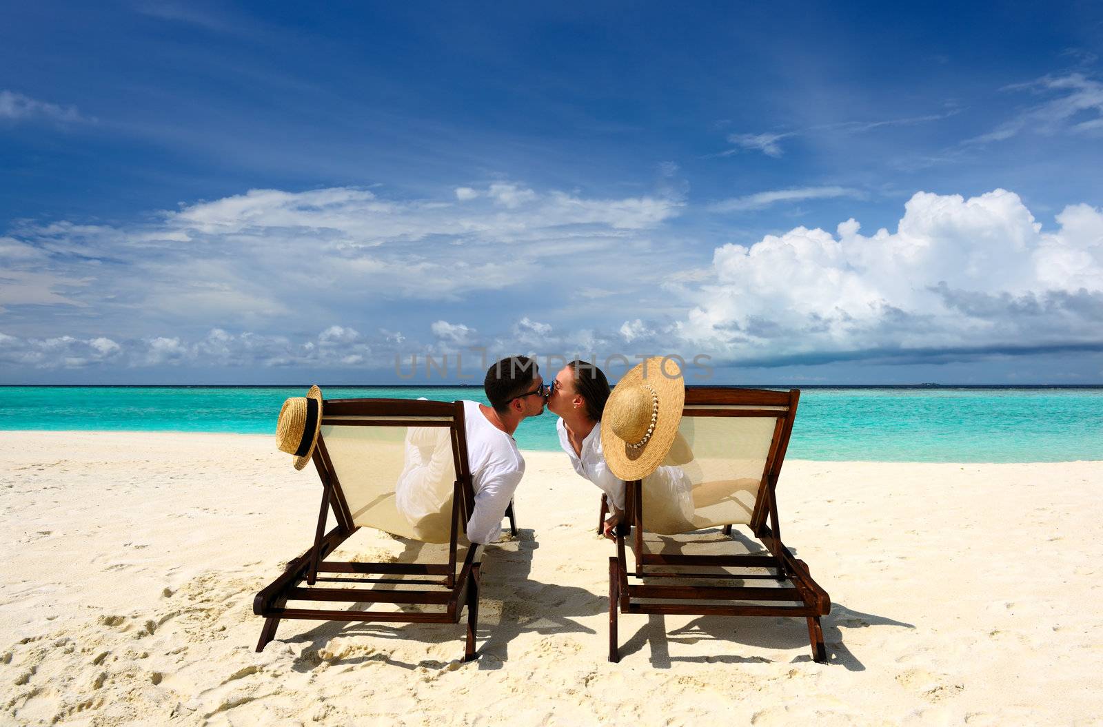 Couple on a tropical beach at Maldives