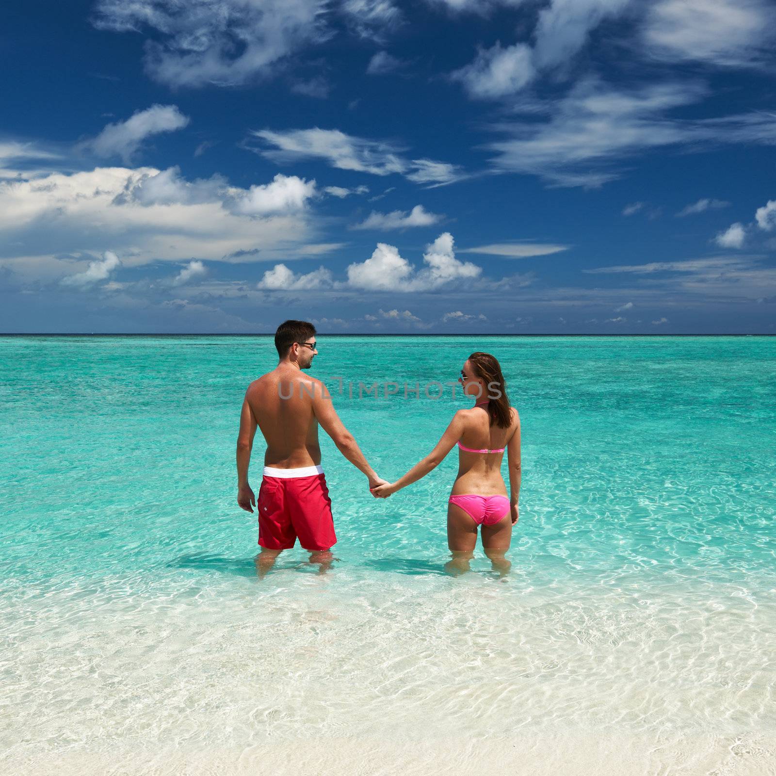 Couple on a tropical beach at Maldives