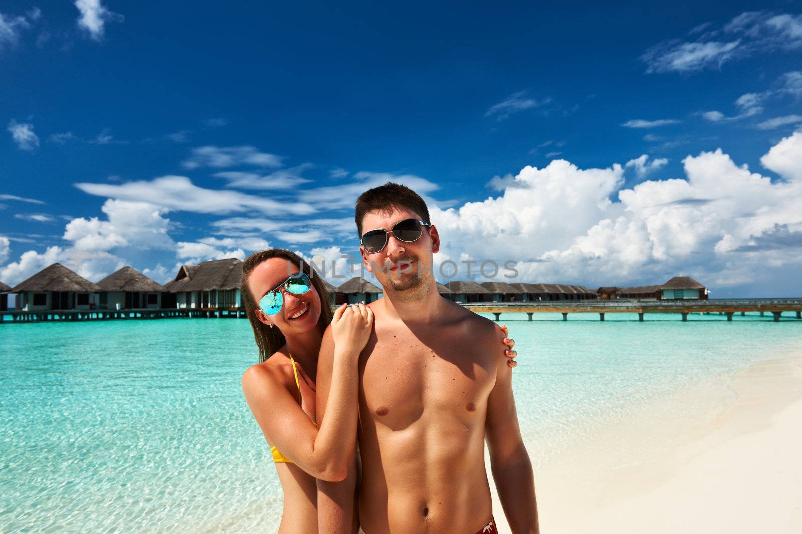 Couple on a tropical beach at Maldives