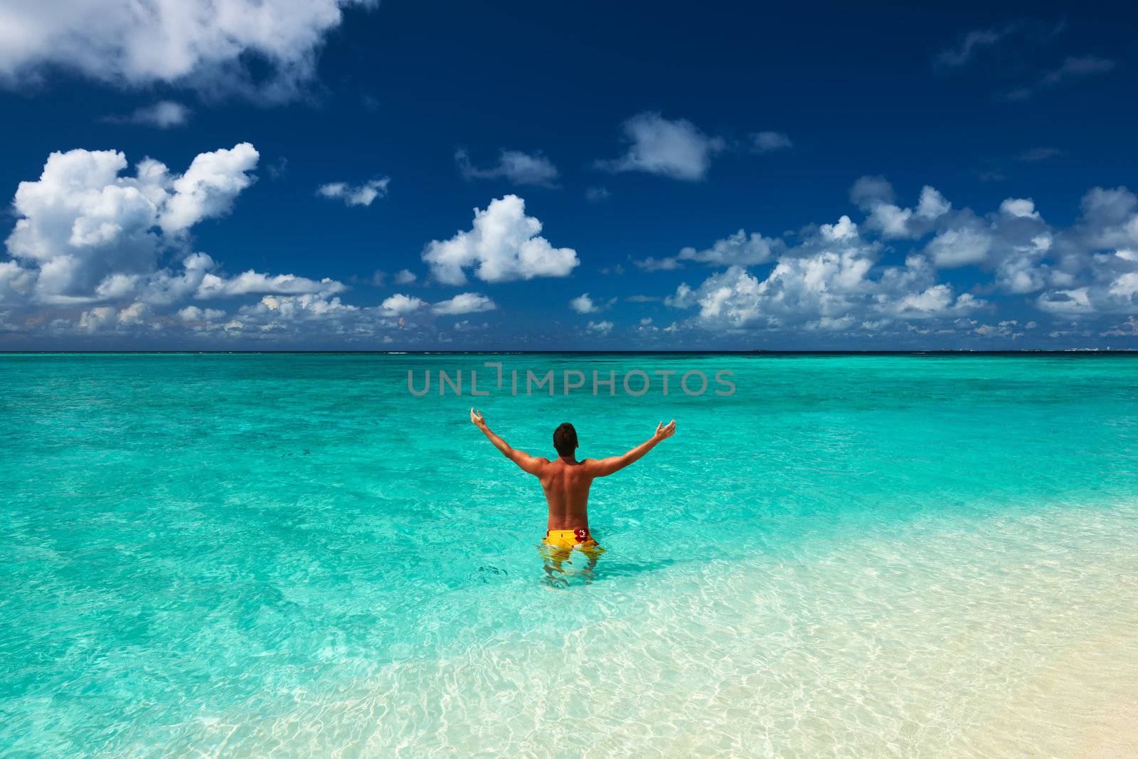 Man at tropical beach at Maldives