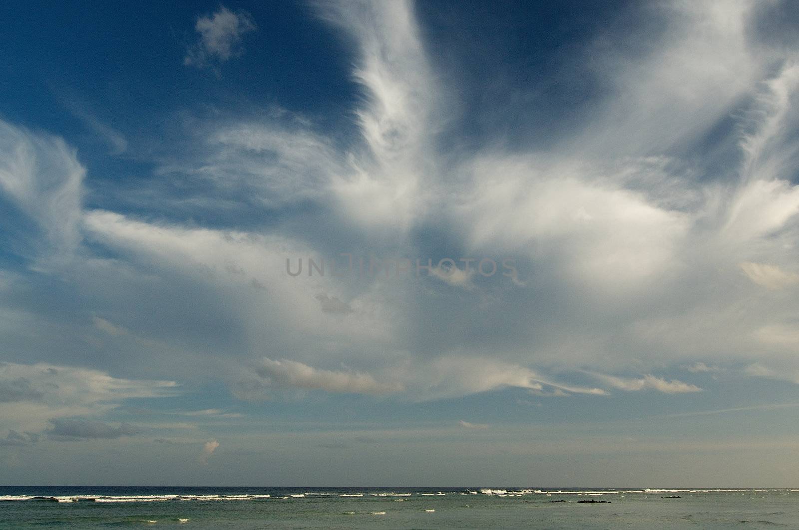 Fleecy Clouds under Ocean Horizon Outdoors