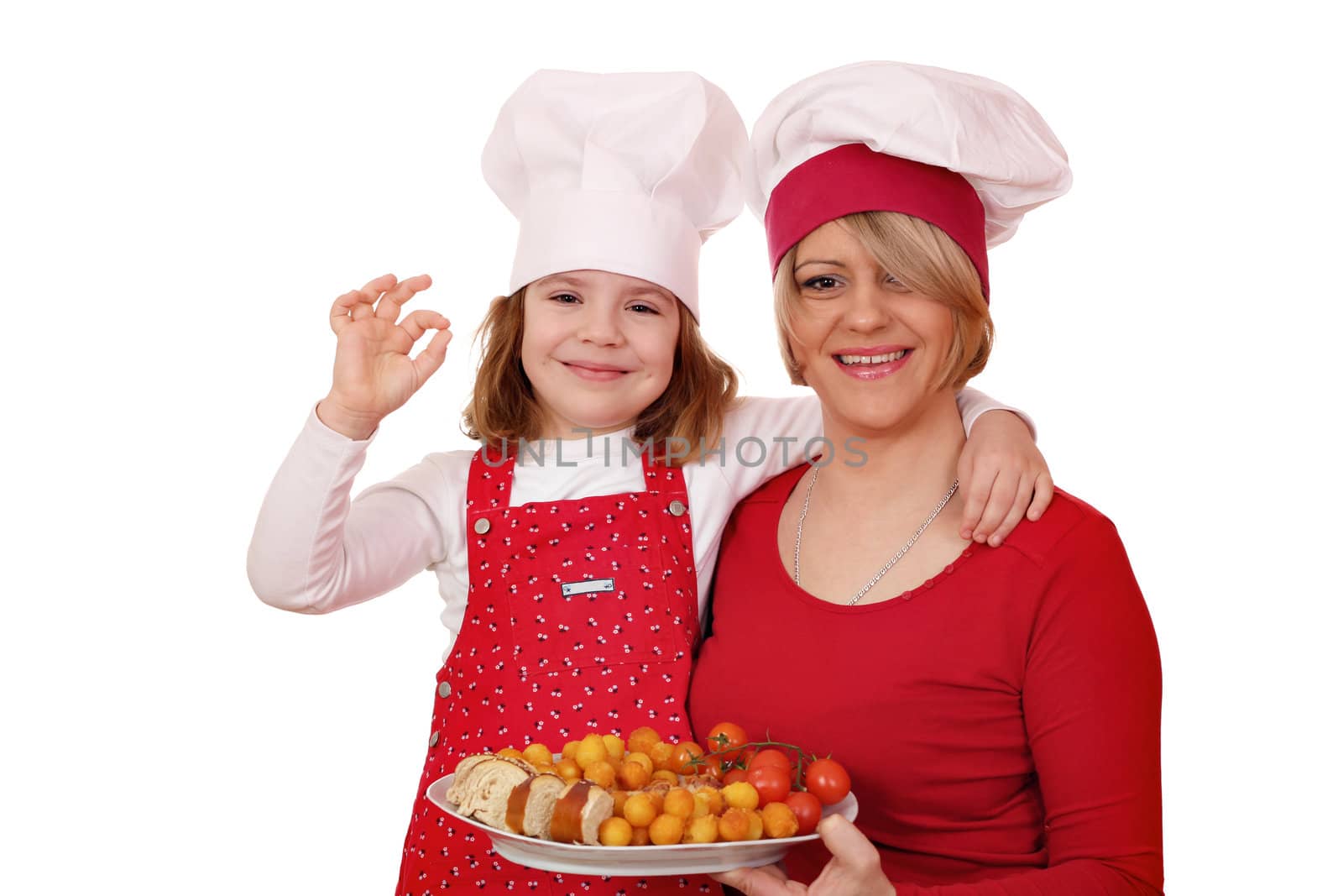 happy mother and daughter cooking