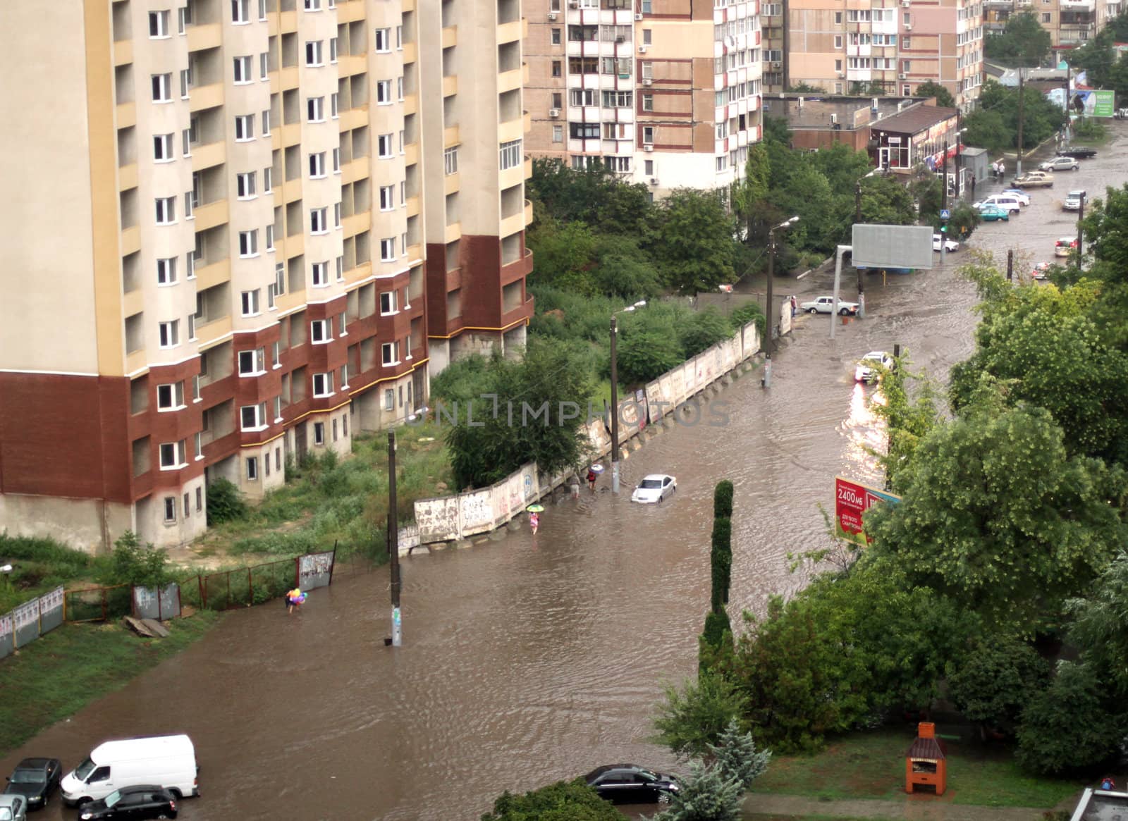 ODESSA, UKRAINE - July 16. Cars attempts to go along the steet through flood waters after a heavy rain on July 16, 2012 in Odessa