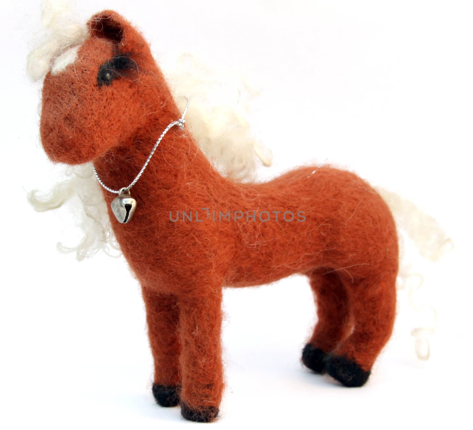 Brown homemade toy felt horse isolated on white background