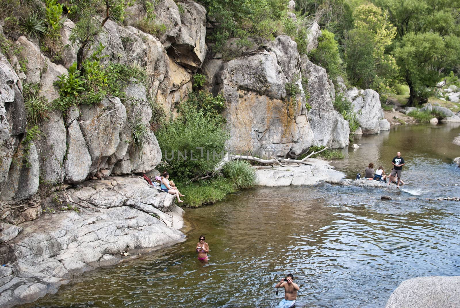 people in the River, Córdoba, Argentina by lauria