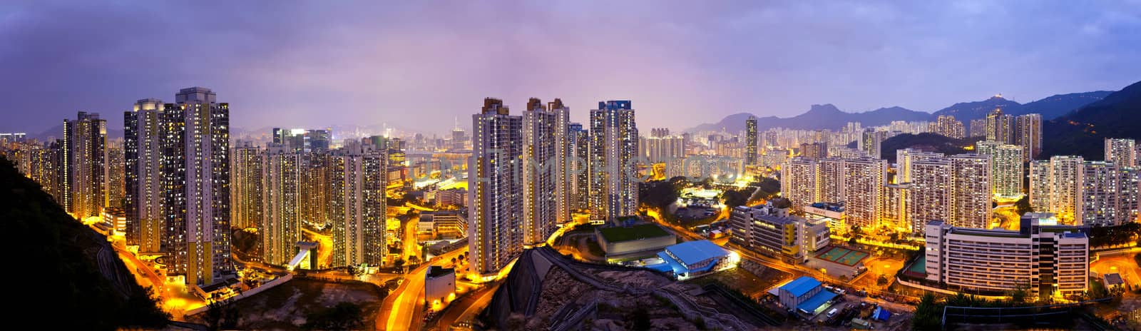 Hong Kong apartments at night, under the Lion Rock Hill. by kawing921