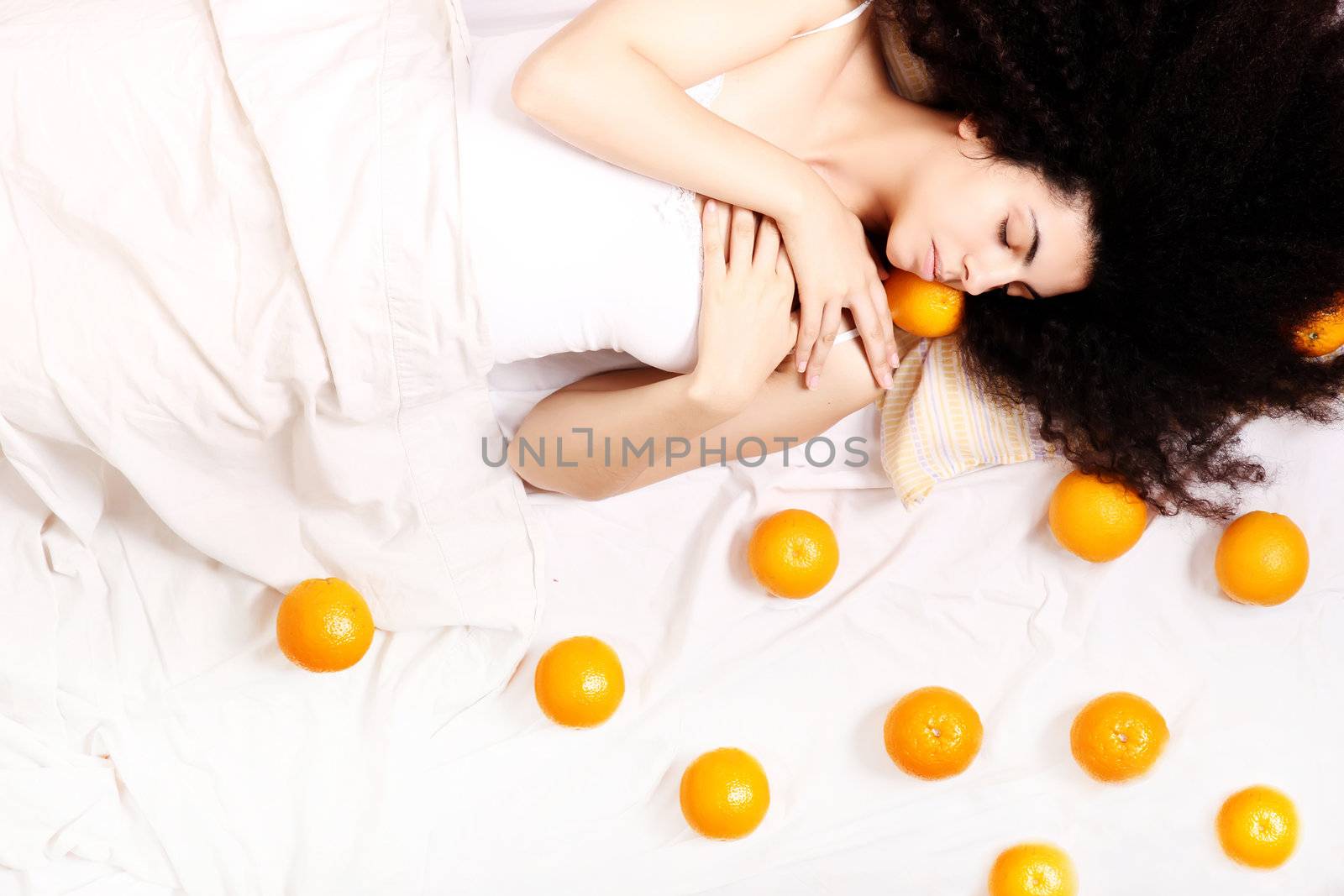 A young south american woman dreaming of fruits.