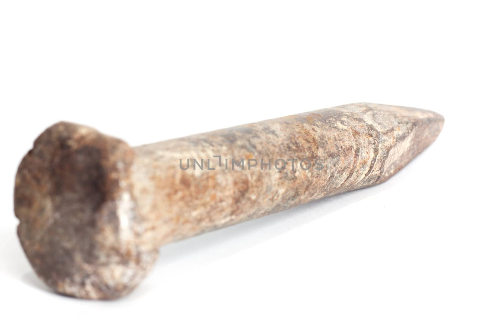Old rusty nail on a white background 
