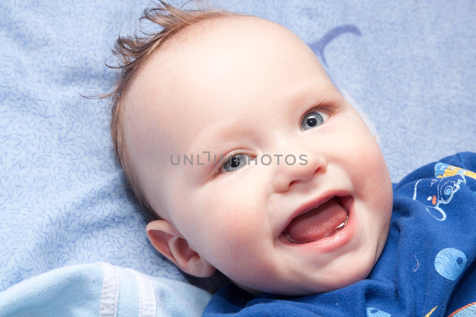 Closeup portrait of cute smiling baby boy by schankz
