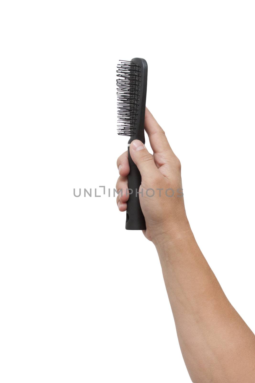 black comb in his hand on a white background