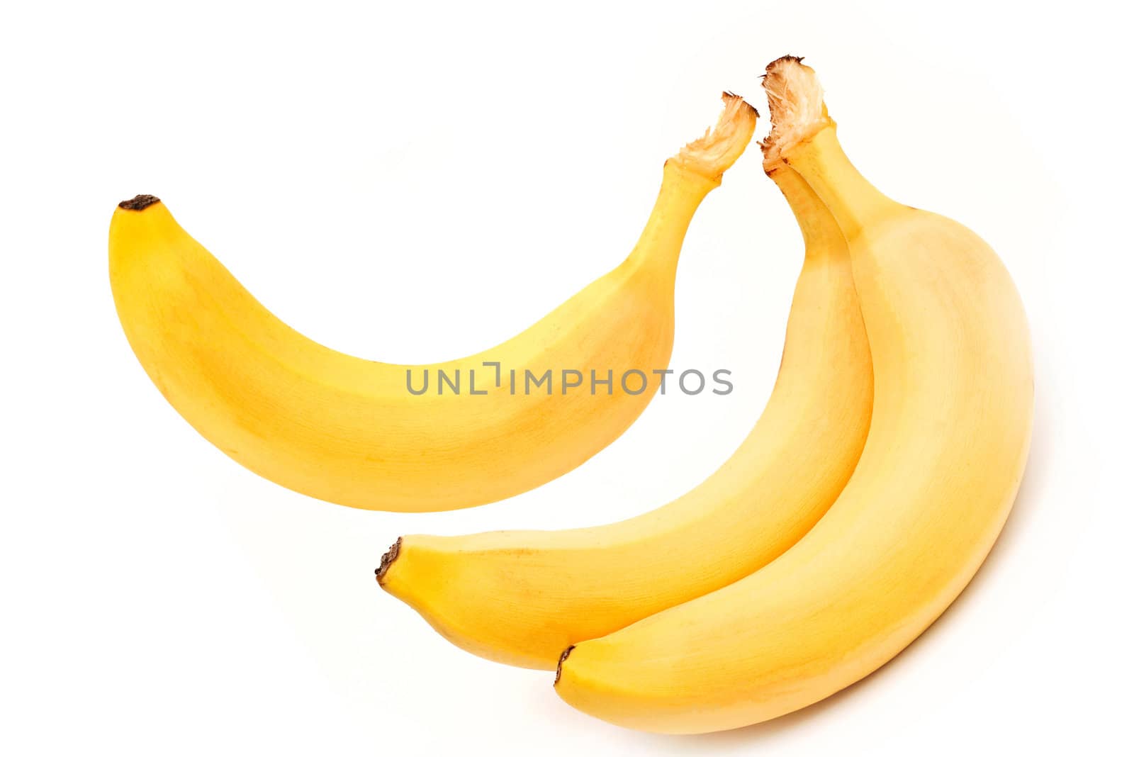 three mature bananas on white background