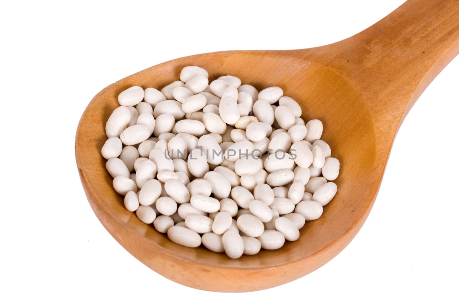 White kidney beans in a wooden spoon isolated on white background