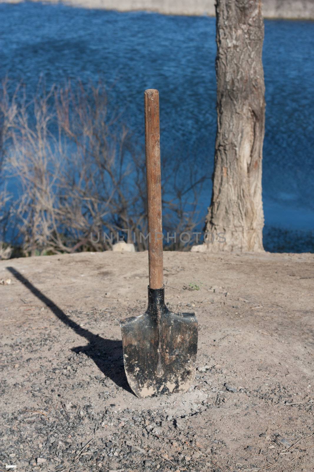 shovel stuck in the ground