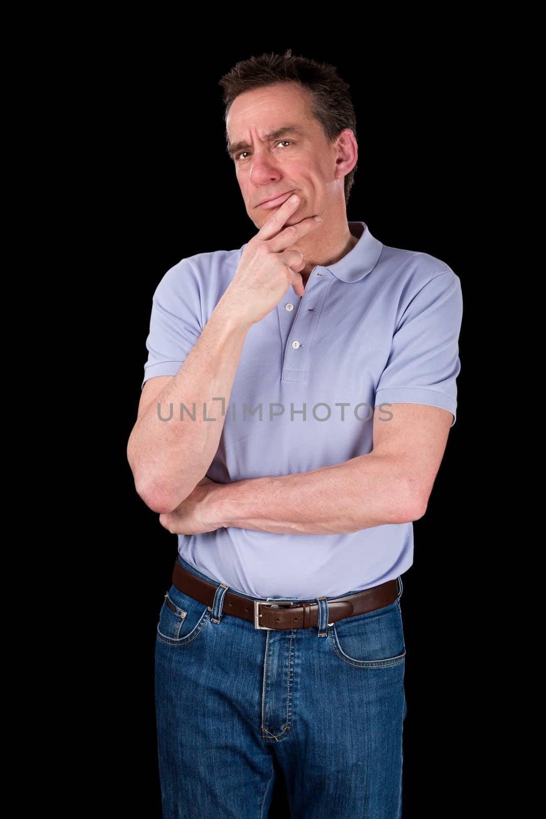Pensive Middle Age Man with Hand to Chin in Thought Black Background