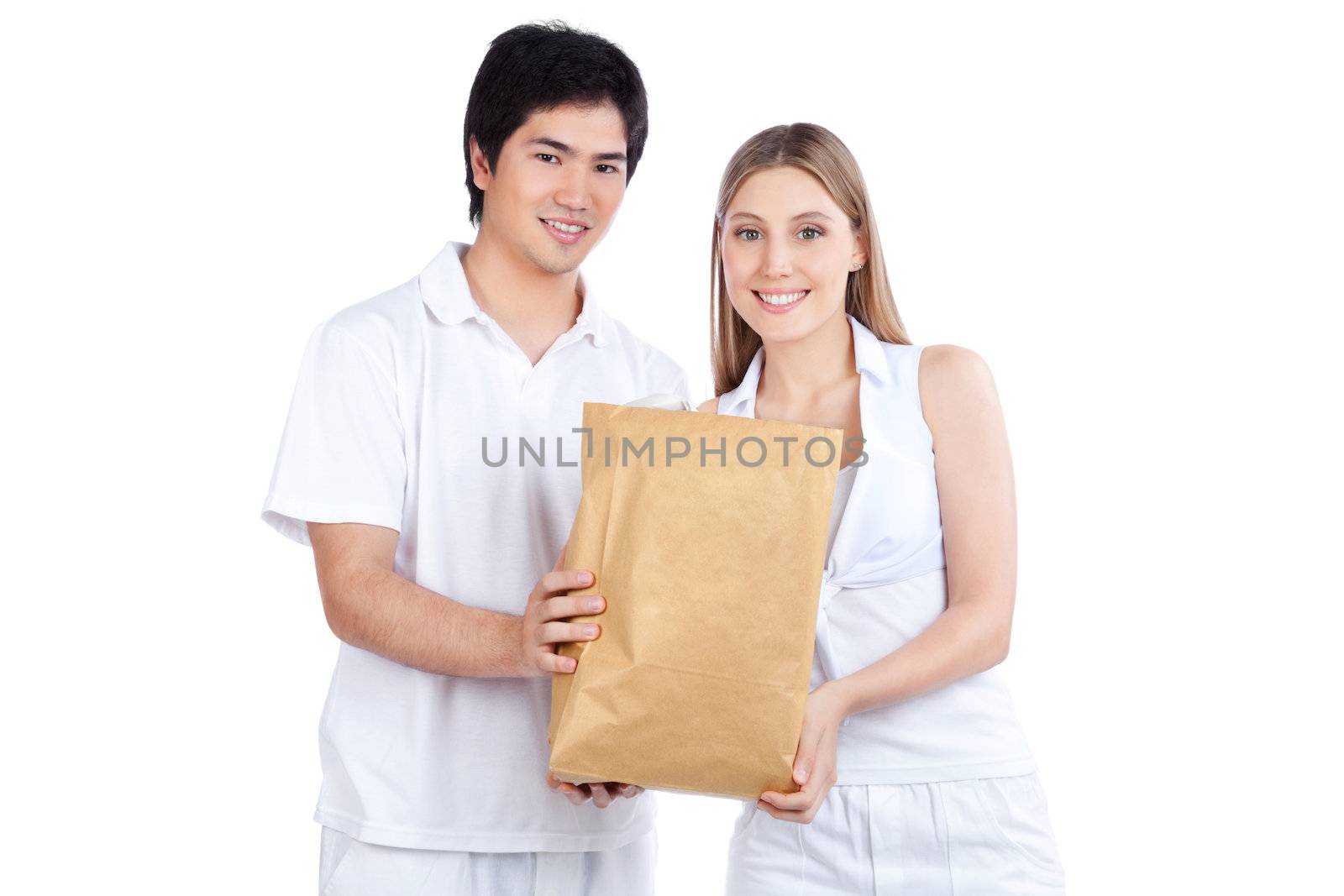 Young Couple  Holding Paper Bag by leaf